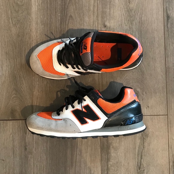 black and orange new balance shoes